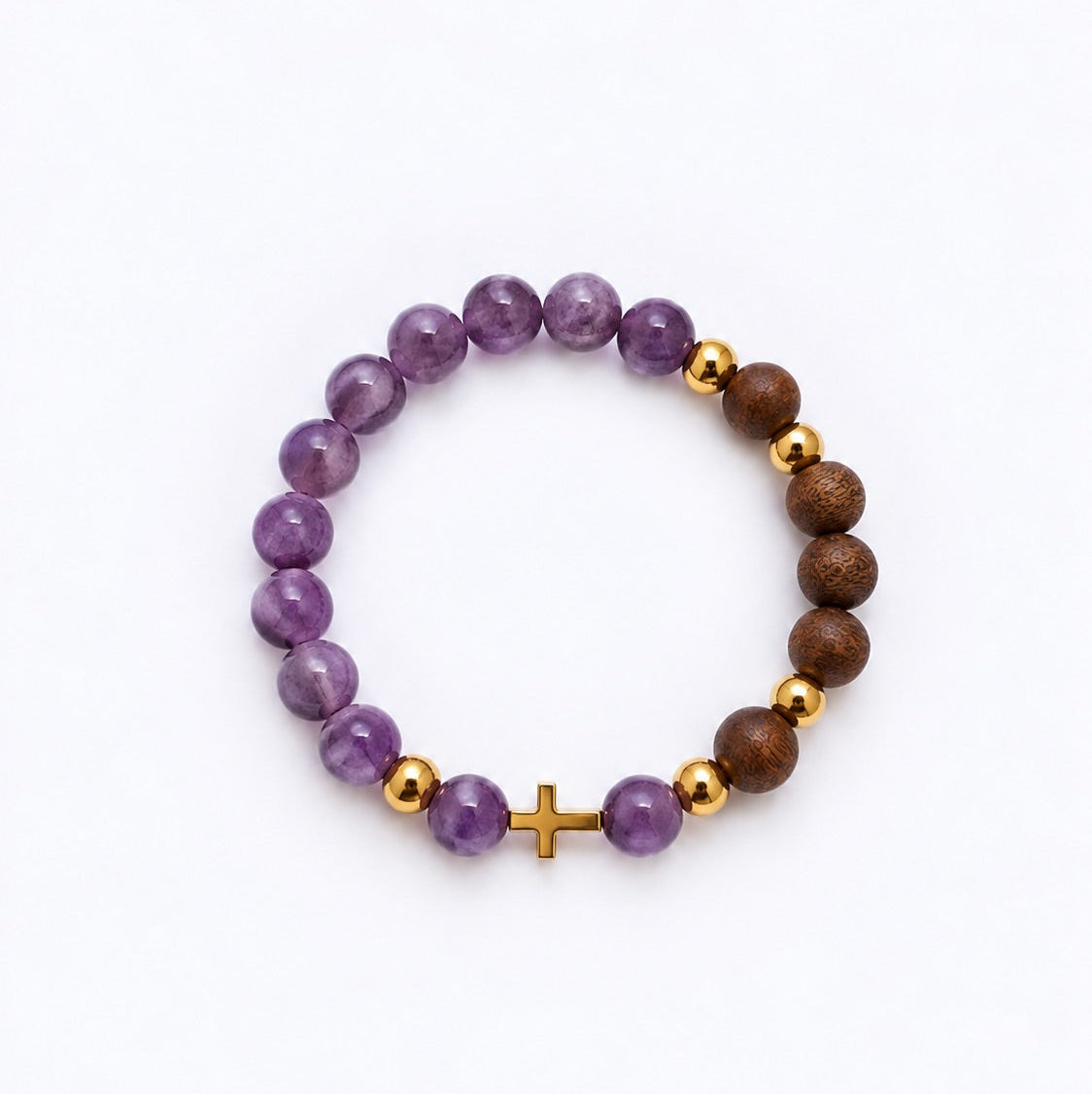 A beaded stretch bracelet featuring purple amethyst beads, brown wood beads, small gold spacer beads, and a small gold cross charm, displayed on a clean white background.