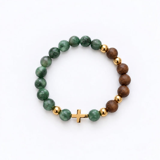 A beaded stretch bracelet featuring green marbled beads, brown wood beads, small gold spacer beads, and a small gold cross clasp, displayed on a clean white background.