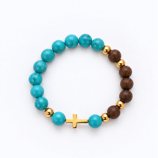 A beaded stretch bracelet featuring turquoise blue marbled beads, dark brown wooden beads, small gold metallic spacer beads, and a small gold cross charm, displayed on a clean white background.